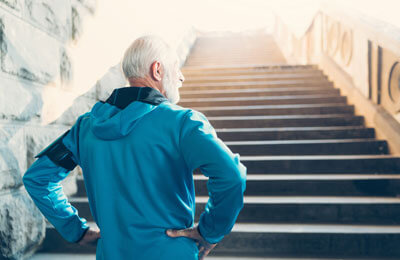 man standing in front of stairs