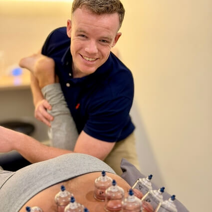 Massage therapist treating a patient