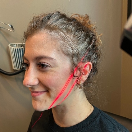 laser on womans face