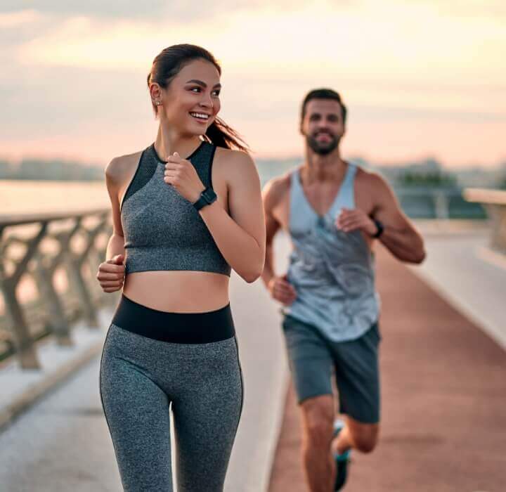 couple running on bridge