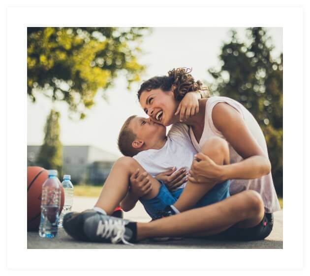 boy kissing mom