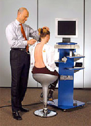 chiropractor scanning a patient