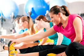 Women stretching in a gym