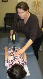 Dr. Laura Vernallis adjusting a patient.