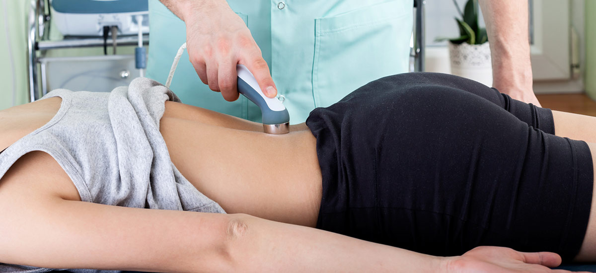 person getting laser therapy on back