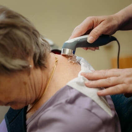 uc therapy on persons shoulder