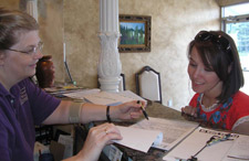 You'll be welcomed by our friendly staff and have all your questions answered. front desk staff welcoming patient