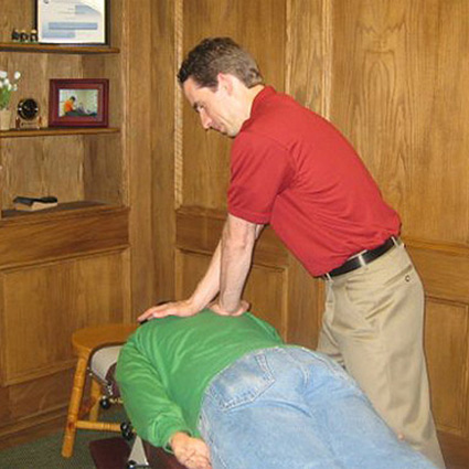 Dr Bradley adjusting patient