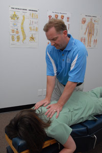 Dr. adjusting a patient