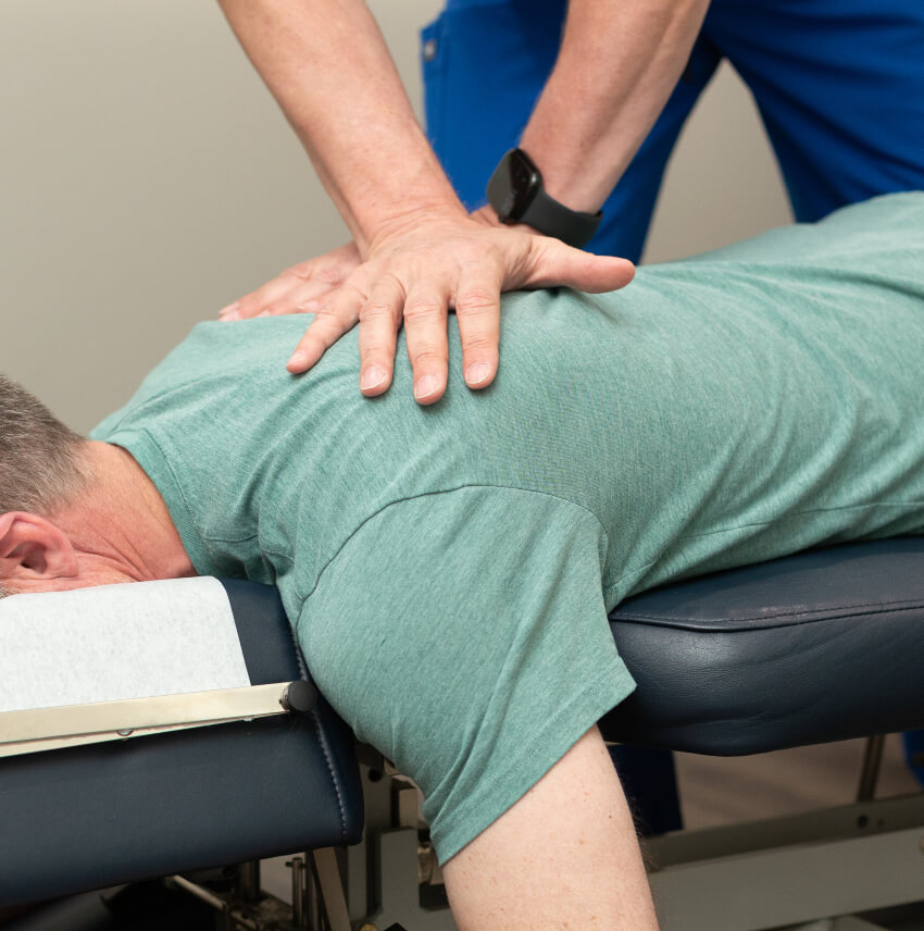 patient having upper back adjusteda