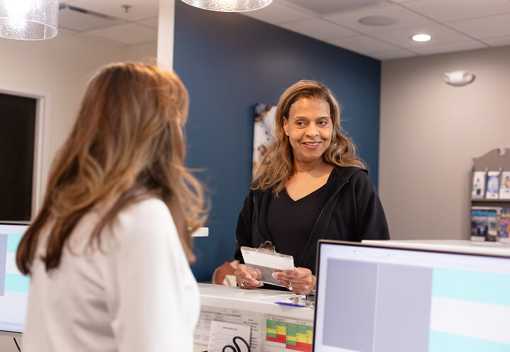 Patient at reception desk