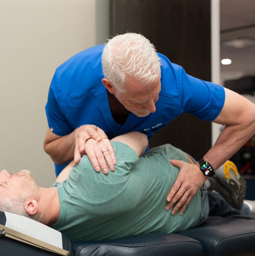 patient having back adjusted