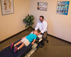 Dr. Josh Ebert adjusting a child 