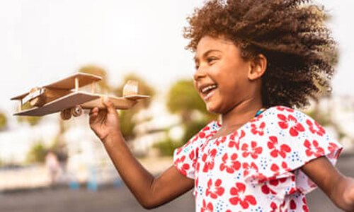 girl-flying-wooden-plane-sq