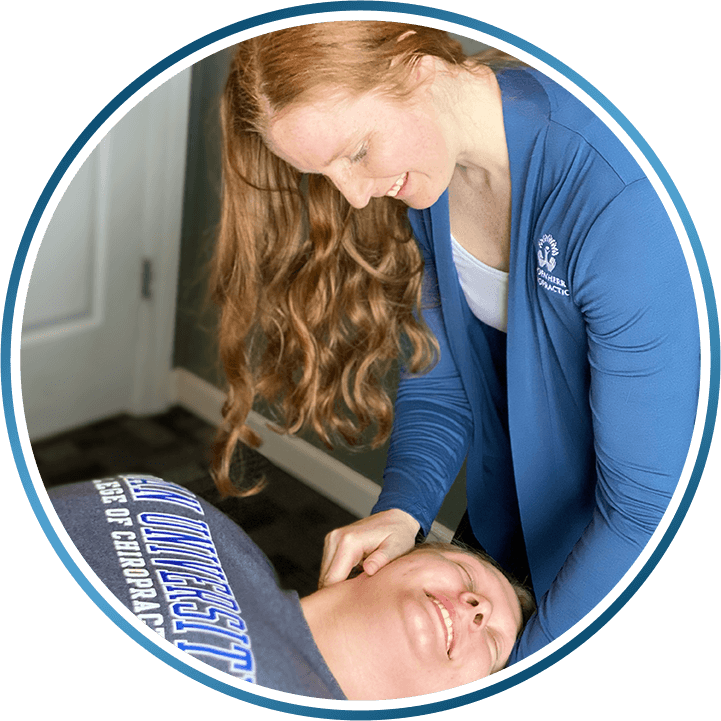 Dr. Julia adjusting patients neck