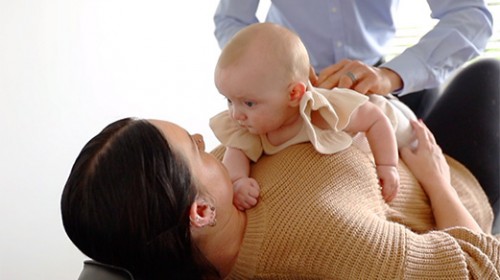 mom with baby on stomach