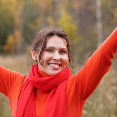 Woman happy arms stretched upward