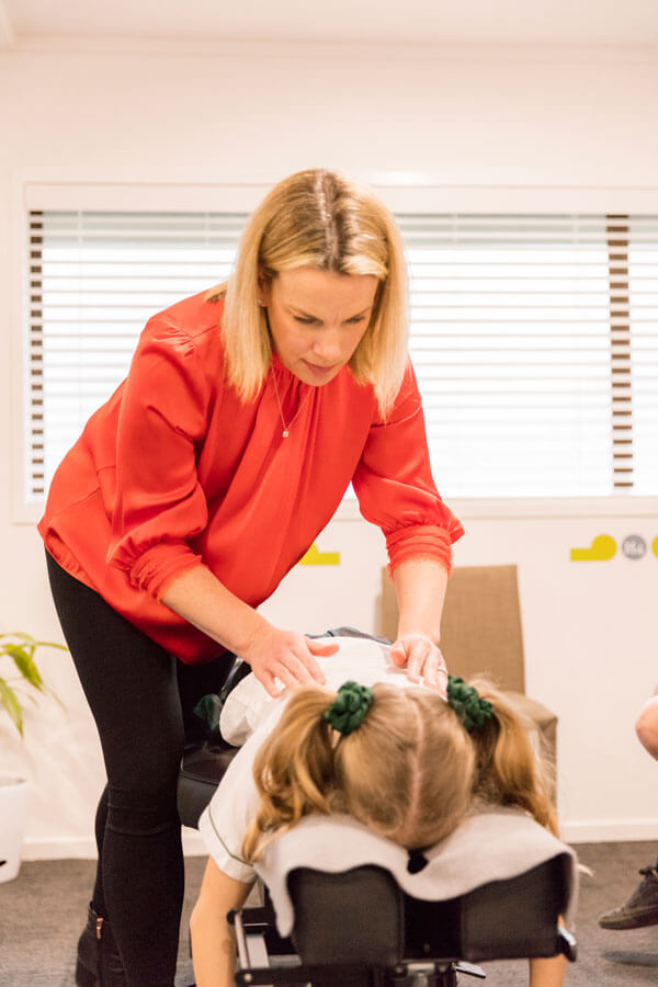 Dr Katie adjusting young patients back