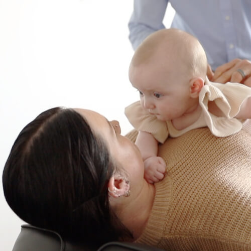 Chiropractor adjusting a baby