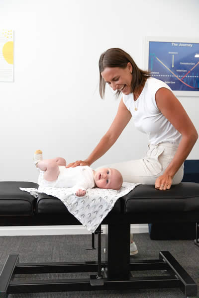 female practitioner adjusting baby