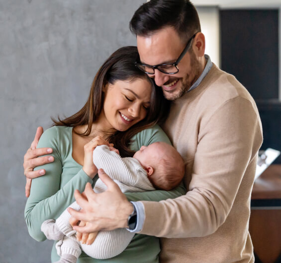 Couple holding their baby