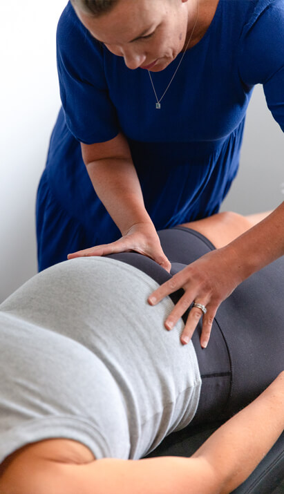 Pregnant woman holding her stomach