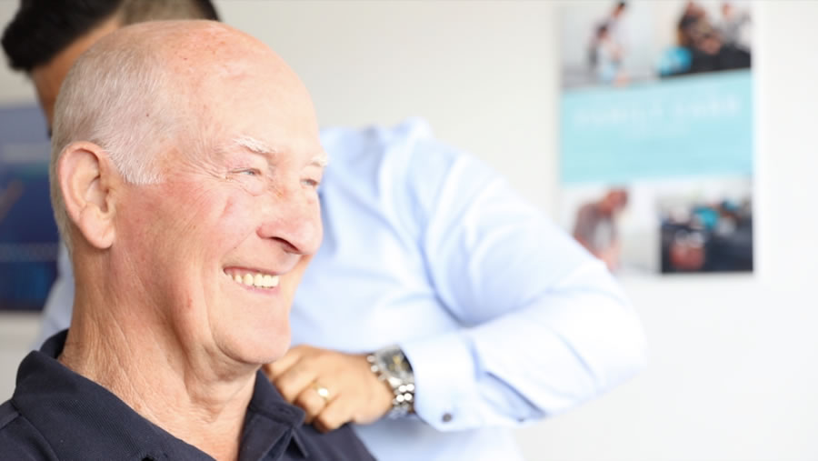 older male patient smiling
