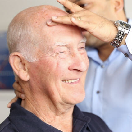 Older man undergoing chiropractic treatment