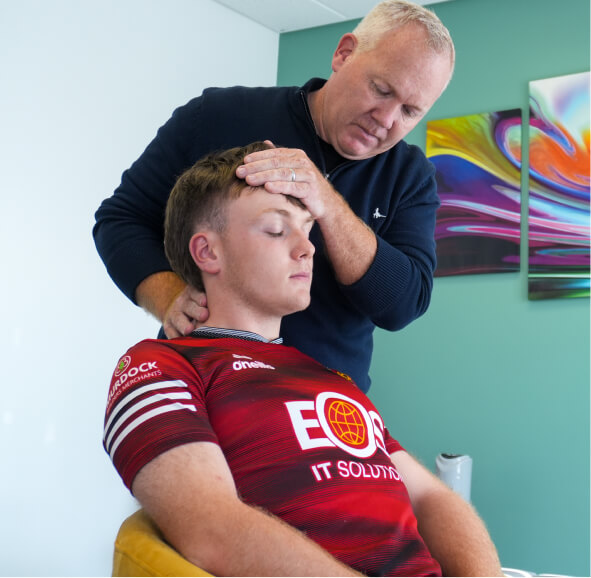 Chiropractor adjusting patient