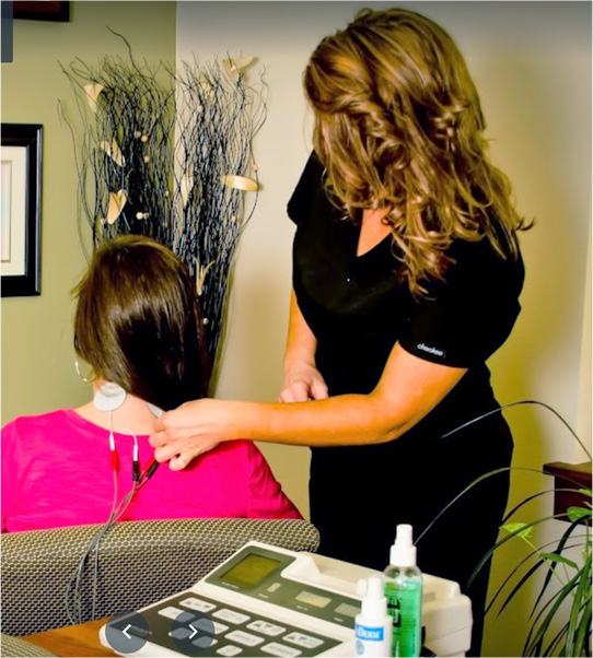 Chiropractor examining patient