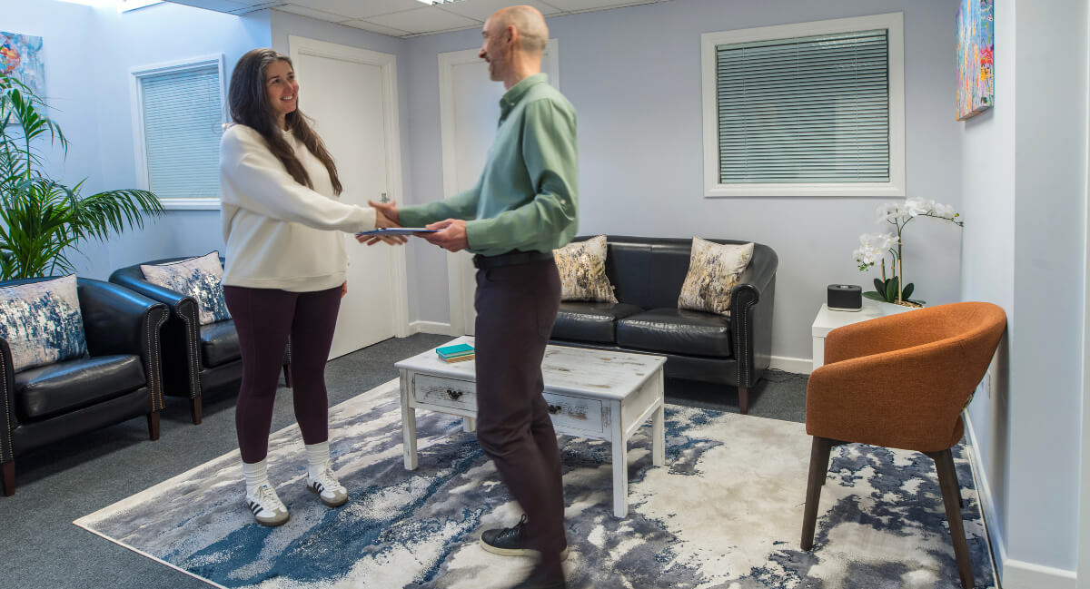 Dr. Kelly greeting patient