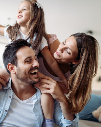 Smiling family of three