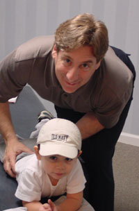 Rutherford Chiropractor, Dr. George Lubertazzo Chiropractor in Rutherford, Dr. George Lubertazzo adjusting a baby