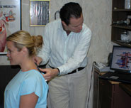 Dr. Woods scanning patients spine
