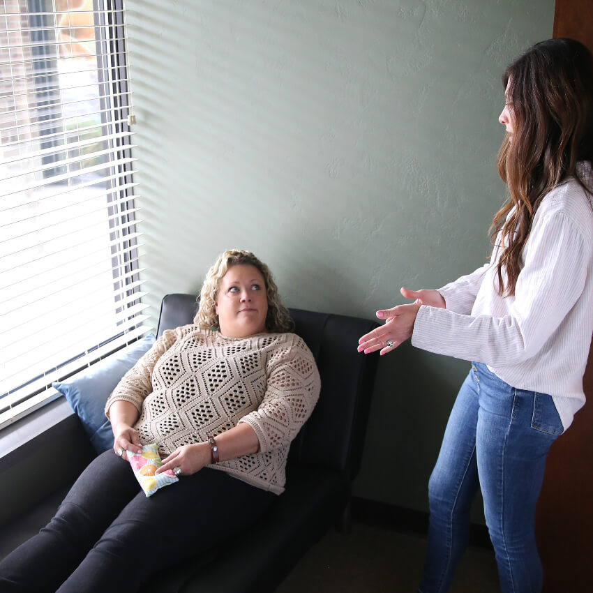Greenville chiropractor Dr Will talking with patient