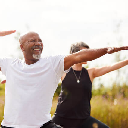 group-of-people-doing-yoga-outdoors-sq