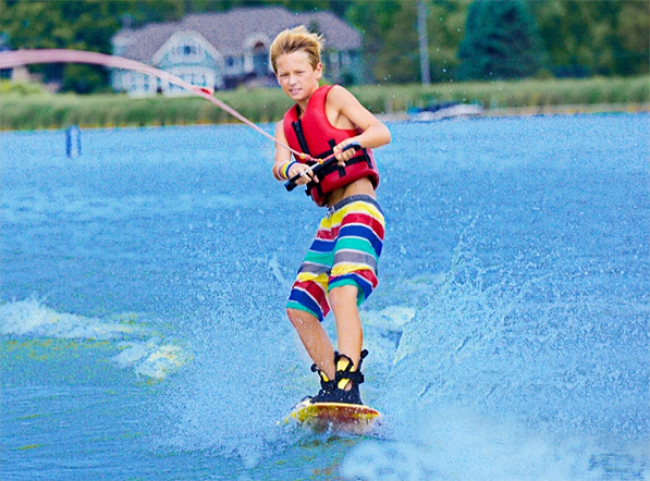 boy water skiing