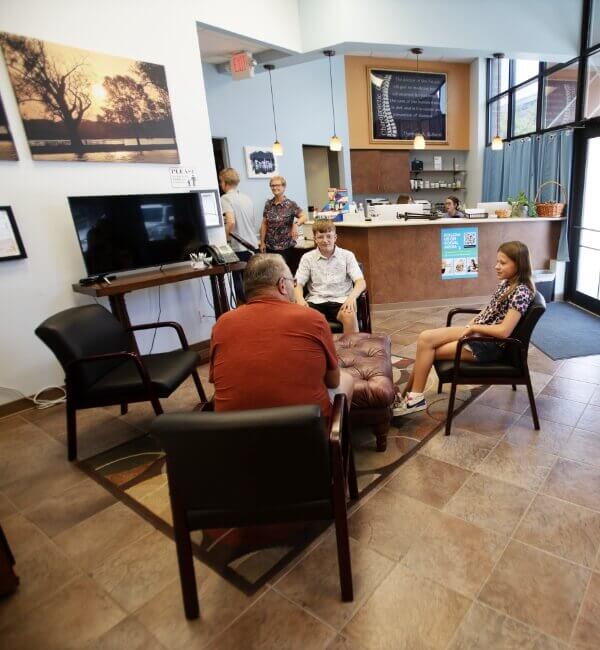 Council Bluffs chiropractor Dr Denise talking to patients