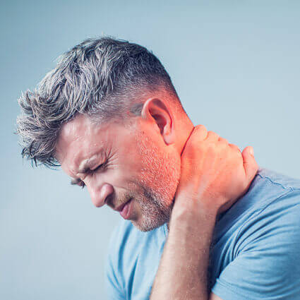 man gripping neck in severe pain