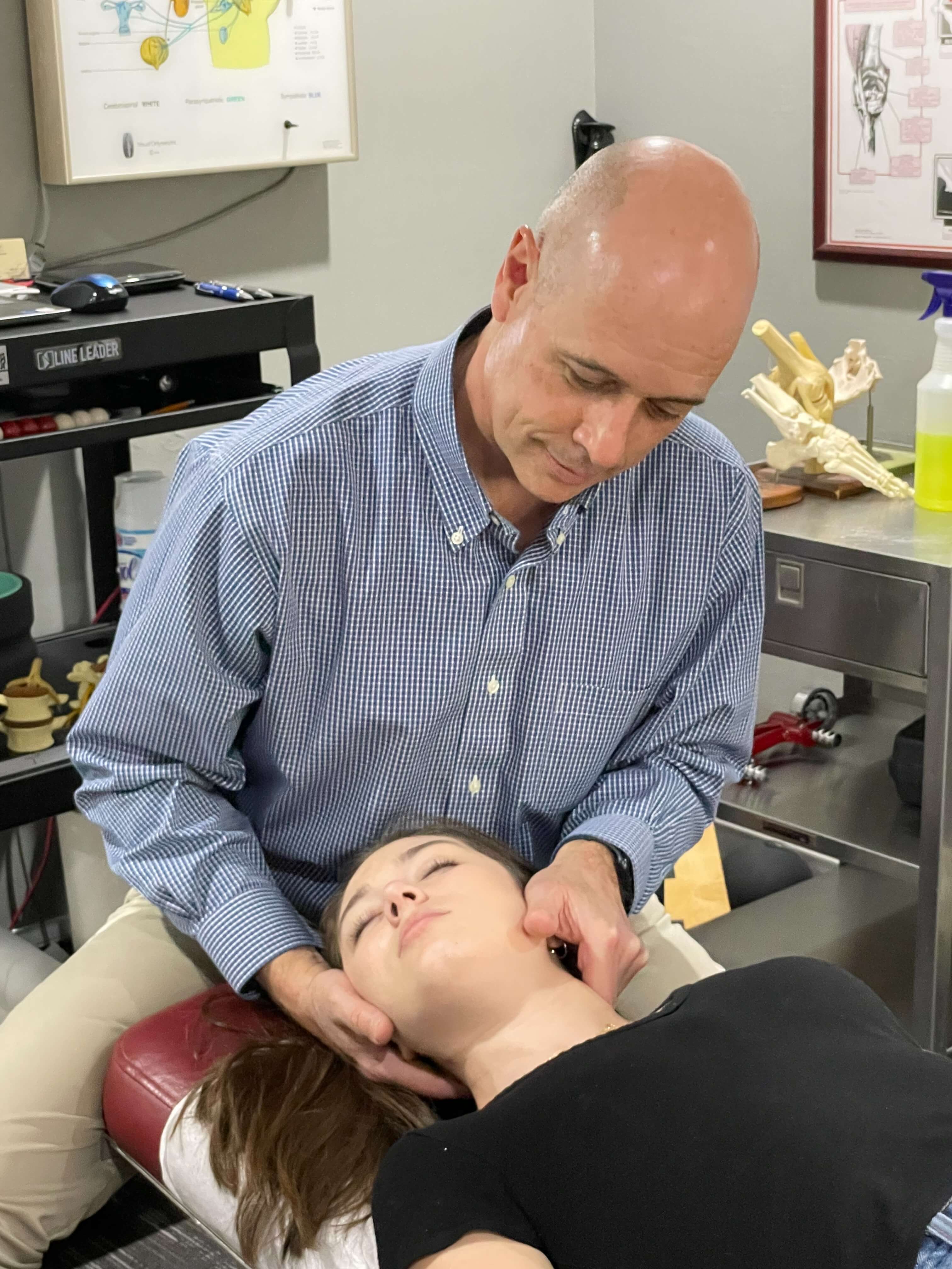 Vernon patient receiving a chiropractic neck adjustment