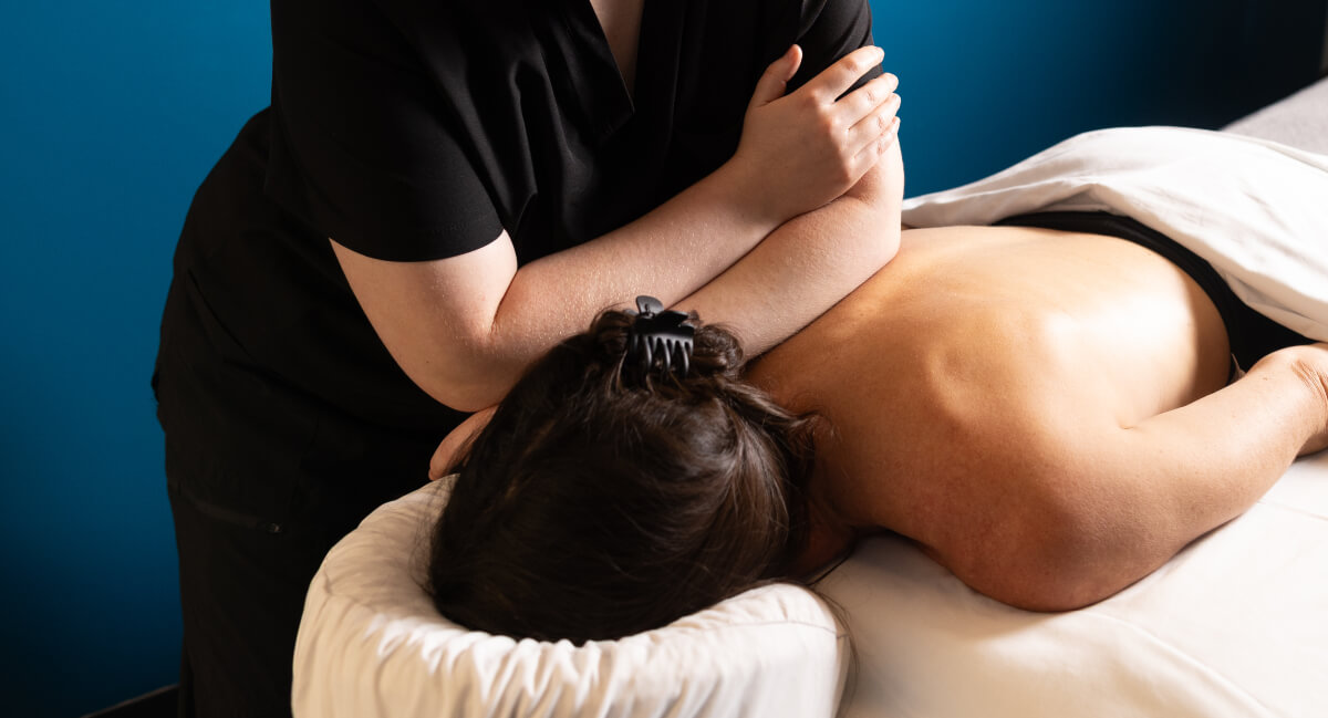 Mueller massage therapist treating a patient