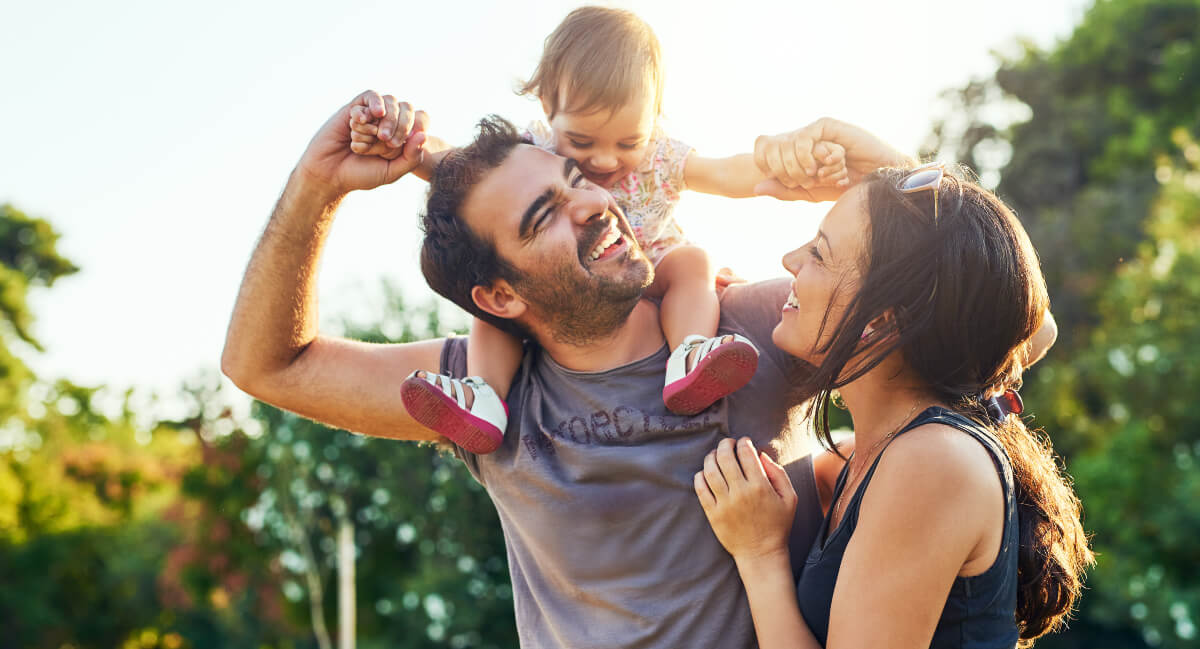 Smiling family of three
