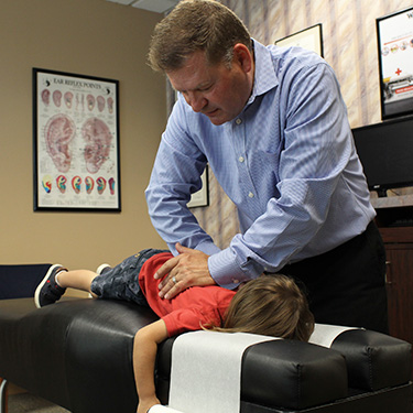 Hands on adjustment by Dr. Stuckey