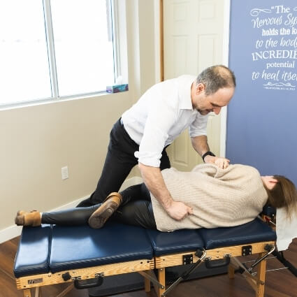 Memorial Drive Chiropractic and Massage patient having lower back adjustment