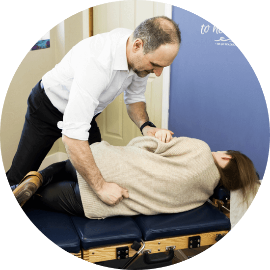 Calgary chiropractor Dr. Ryan adjusting patient