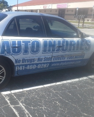 car with advertisements on the sides
