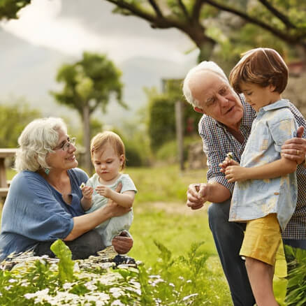 kids with grandparents in the garden