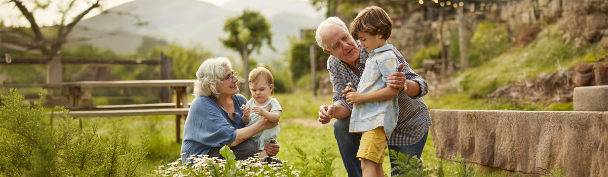 kids with grand parents in the garden