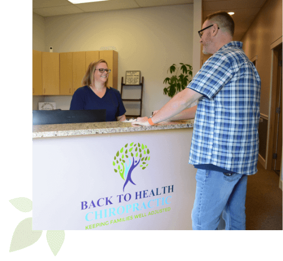 patient checking in at Back To Health Chiropractic front desk