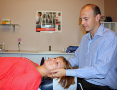Chris Charlton adjusting a patient.